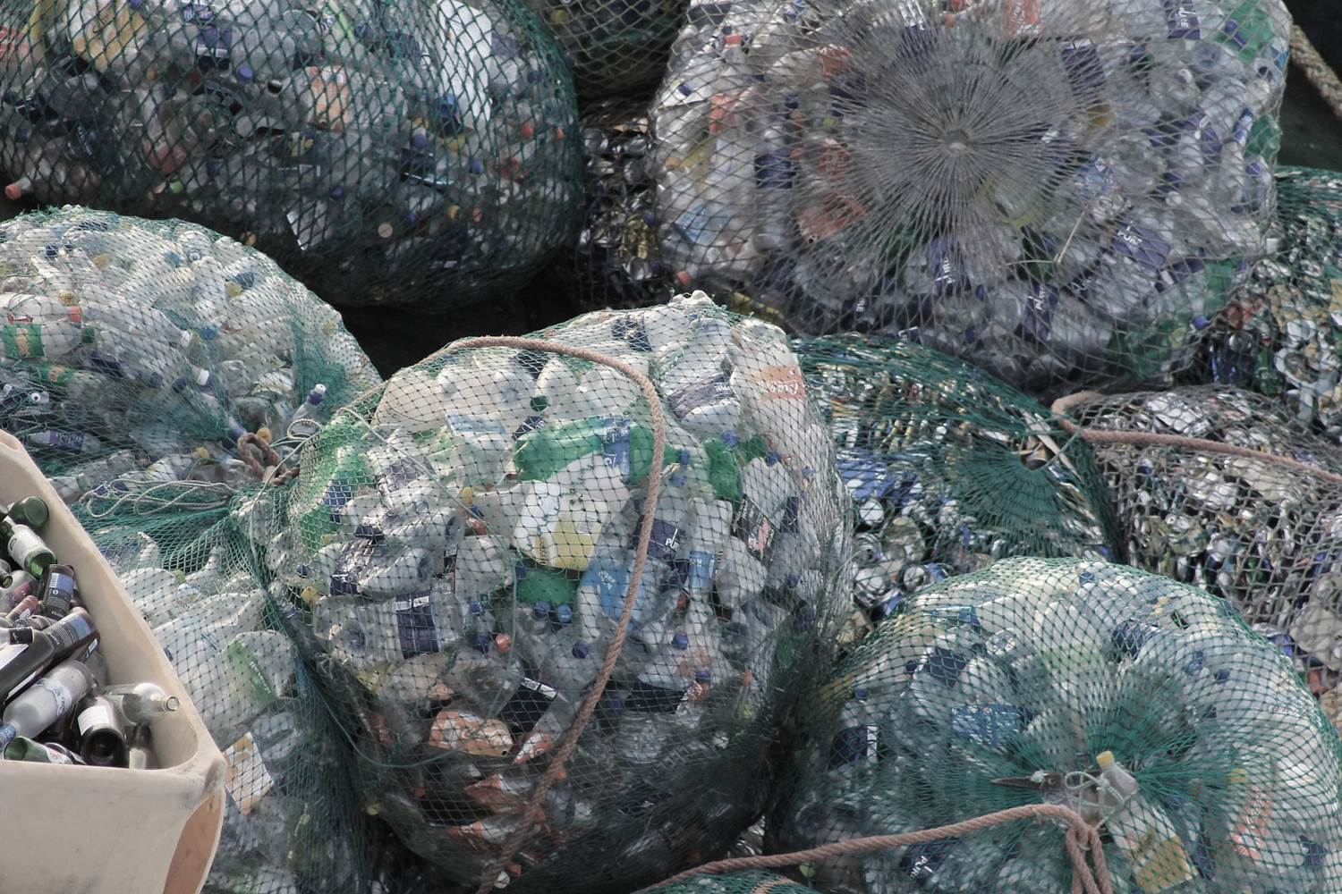 Plastic bottles in mesh bags