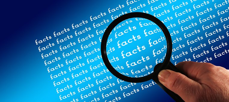 Magnifying glass over the word 'facts'