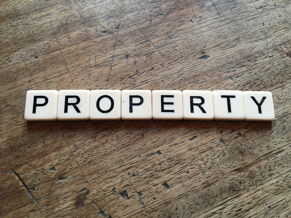 Scrabble tiles spelling out 'property'