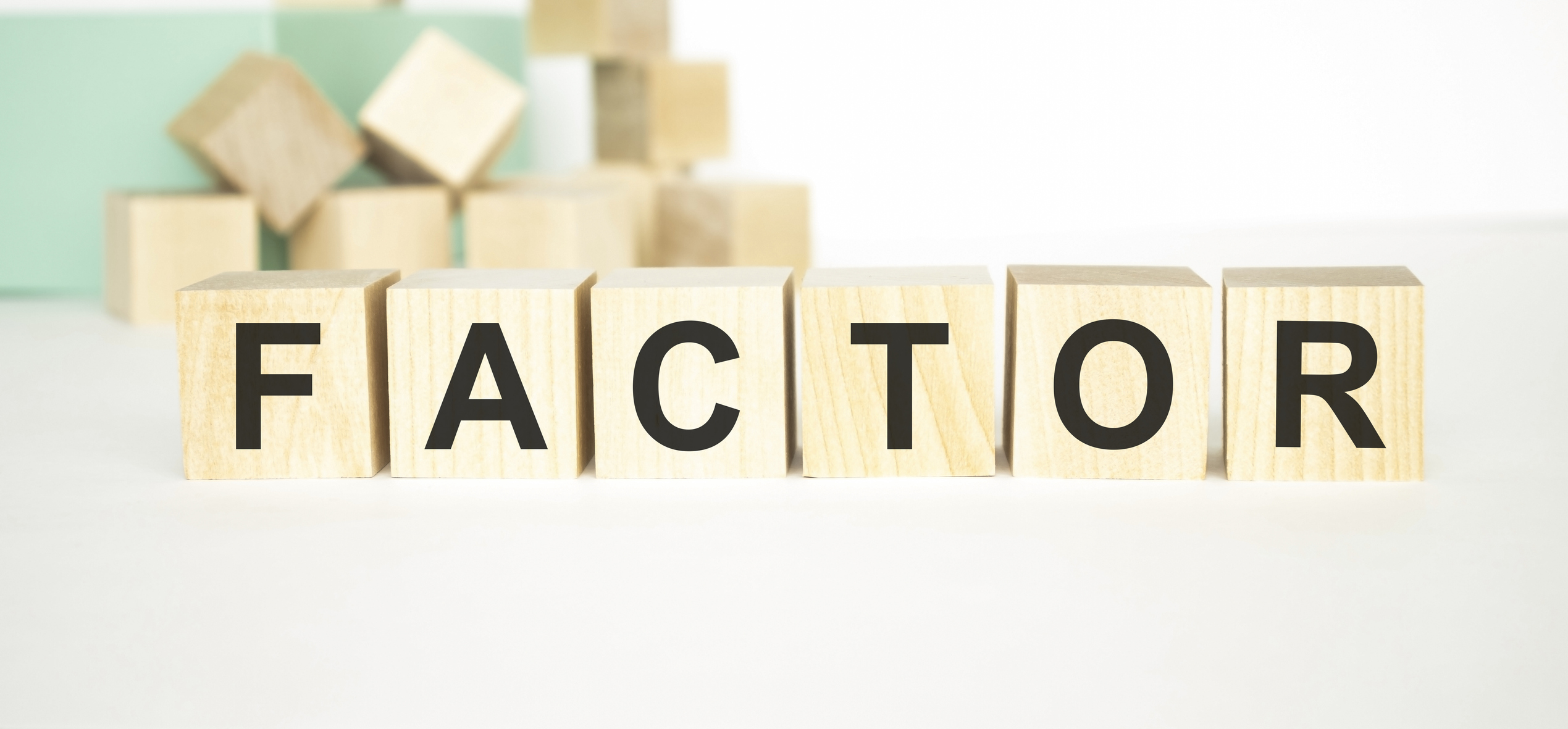 'Factor' spelled out on wood blocks