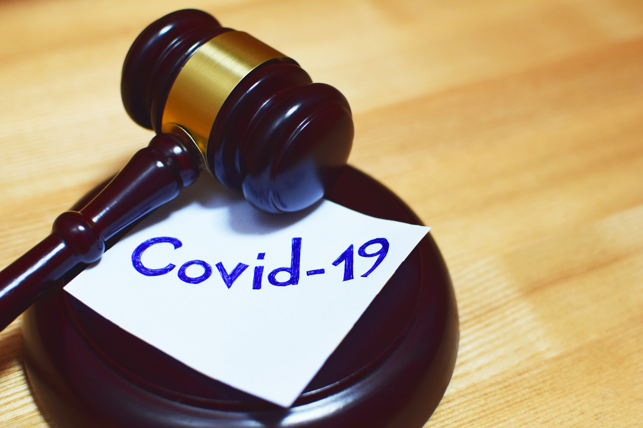 Gavel with COVID-19 note
