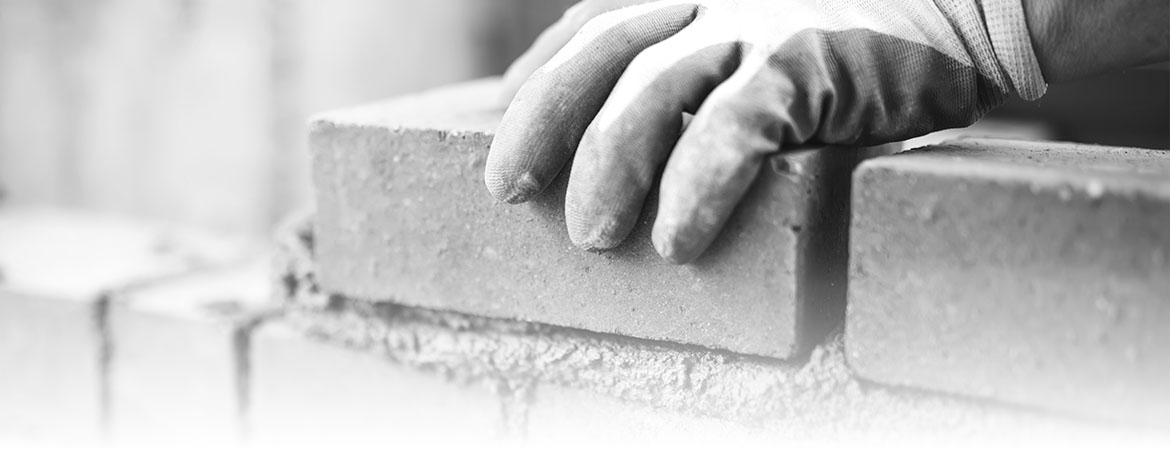 Bricklayer placing a brick