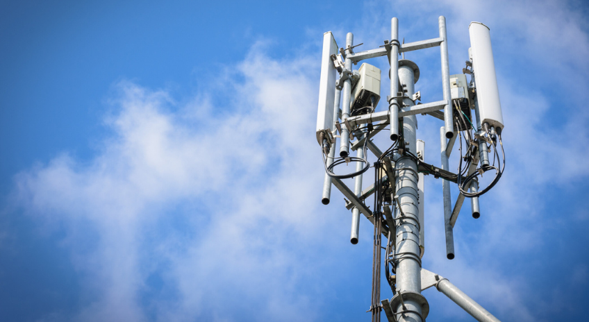 Phone mast against blue sky